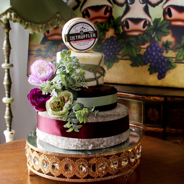 Wedding cheese cake stack with flowers and decorations