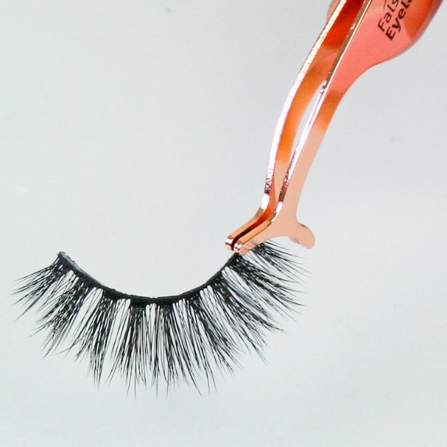 tweezers holding falsies