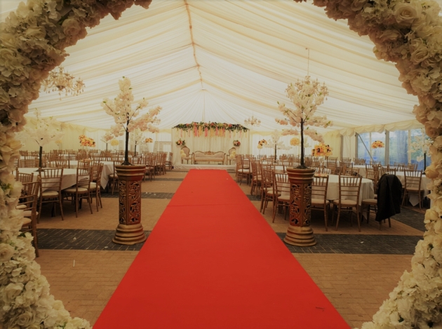 The Grand Marquee with floral arch and cherry blossom trees at Holiday Inn Leeds Bradford