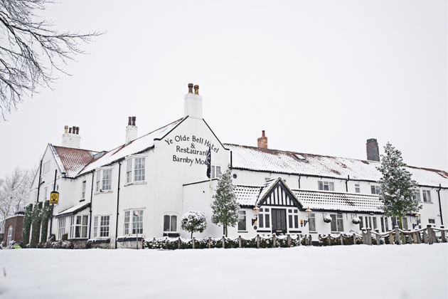Exterior shot of Yorkshire wedding venue Ye Old Bell Hotel & Spa in snow.