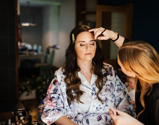 Yorkshire make-up artist Abby Kaye applies a bride's make-up.