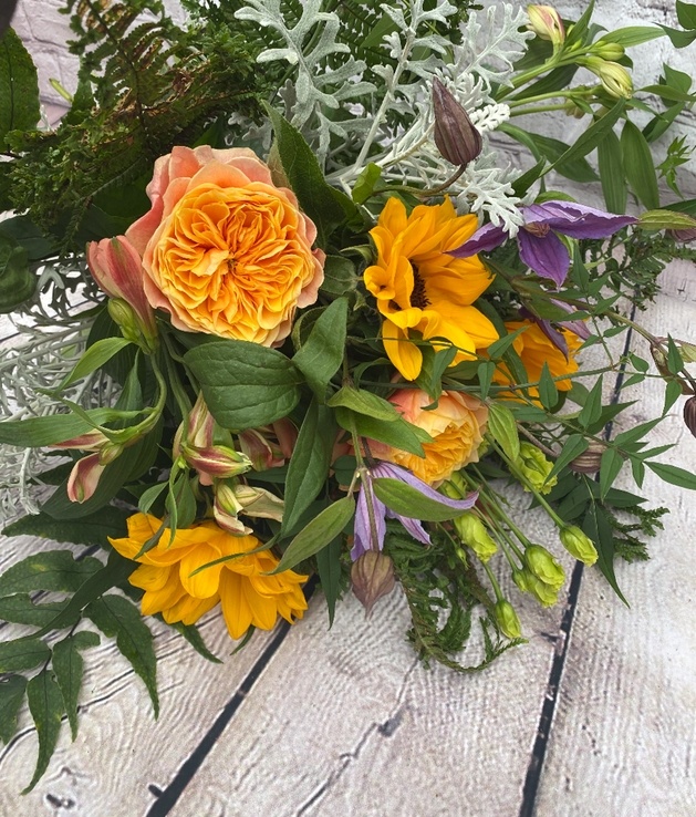 Faux flower bouquet in orange and purple flowers from Yorkshire florist Wildflowers