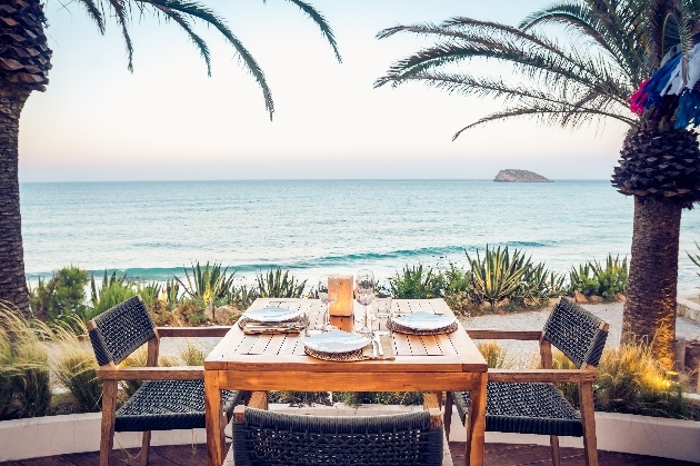 dinner table on terrace looking out to ocean