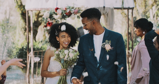 couple married walking down aisle