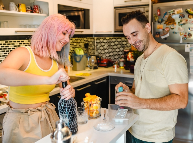 couple making cocktails 