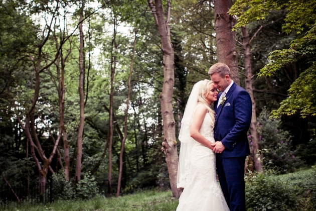 Bride and groom in woodland