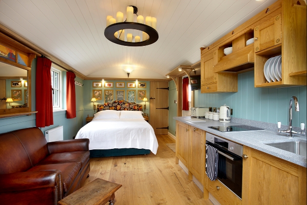 interior of huts with leather sofa and kitchenette