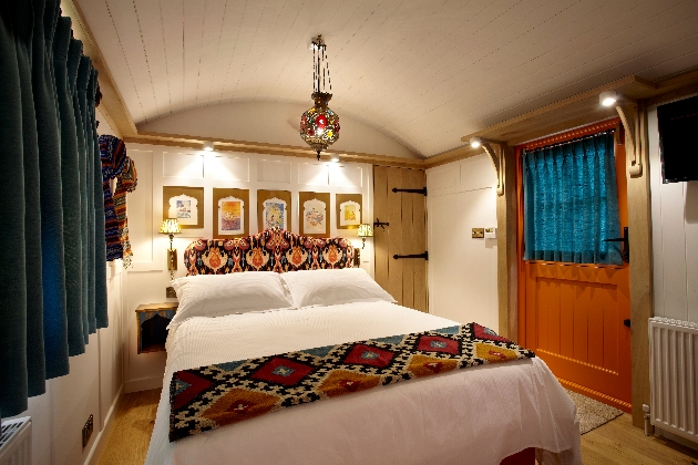 Bedroom at night with turkish lamp and large bed