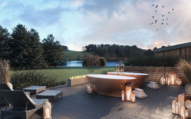 outdoor garden area with copper baths and candles lit at night