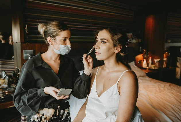 image of bride getting make-up done