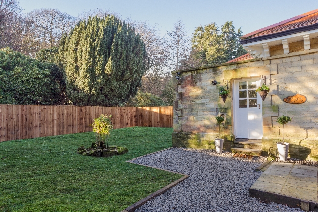 stone cottage with garden area