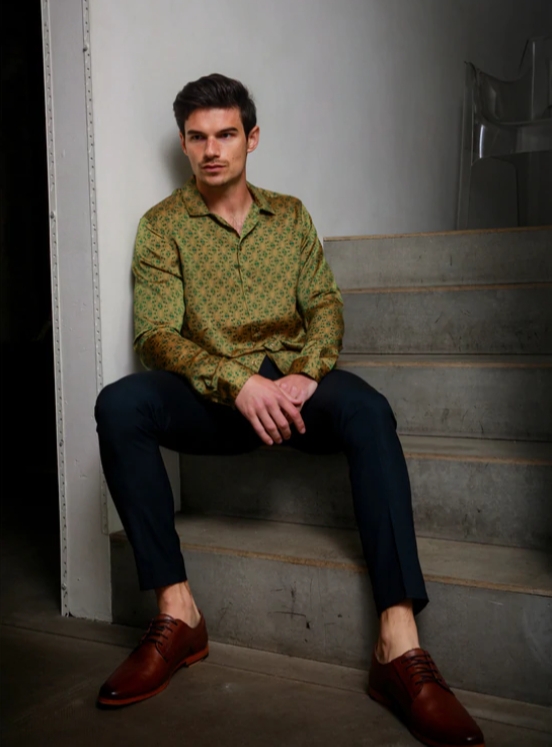 Groom posing on the stairs