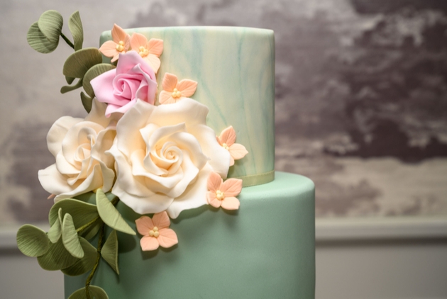 Blue watercolour wedding cake with flowers