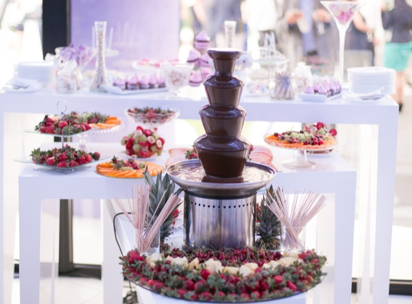 chocolate fountain with a buffet of fruit to dip