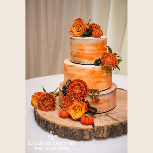 Bold and bright orange wedding cake