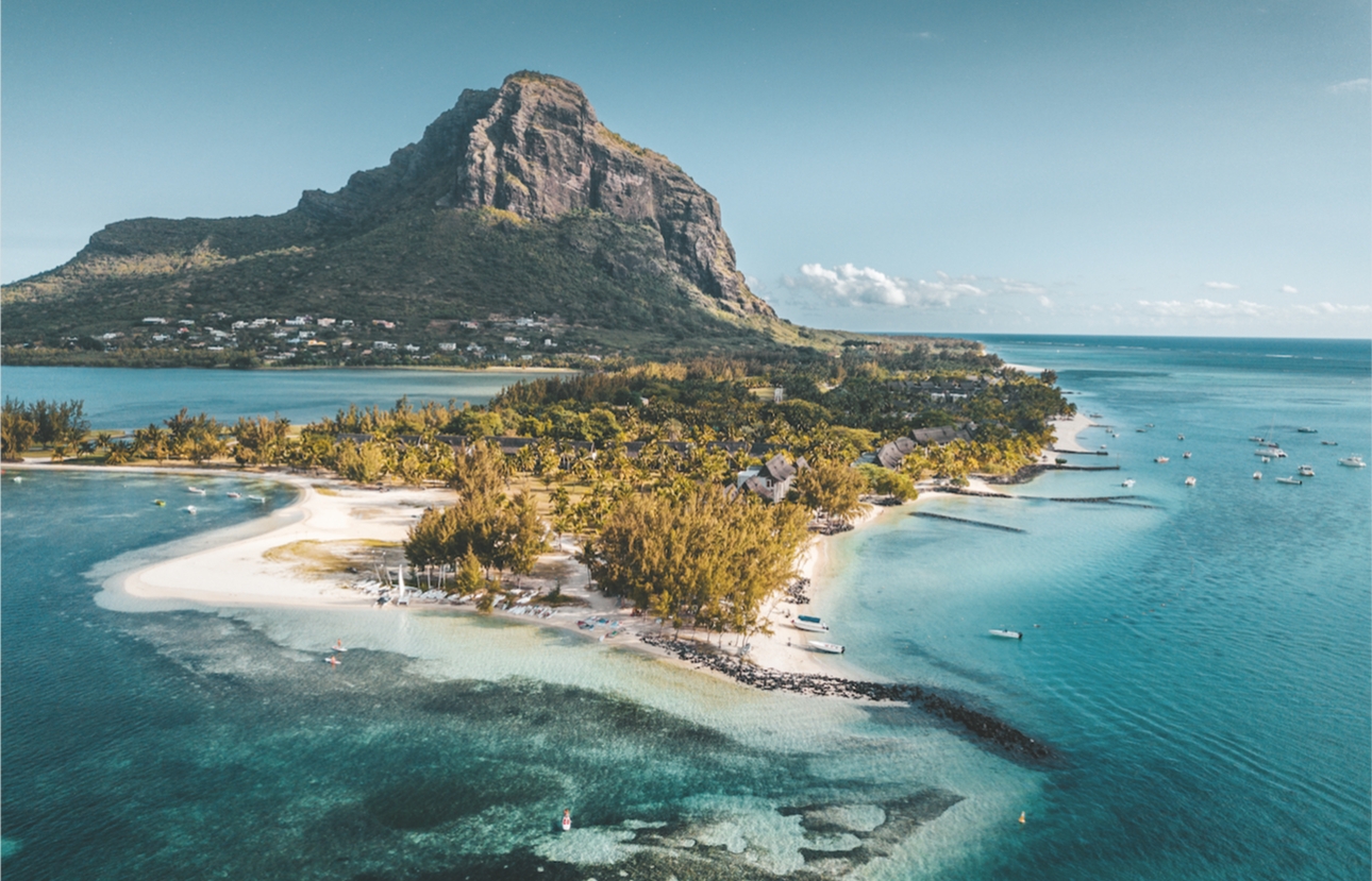 view of a mountain island and beaches surrounded by sea