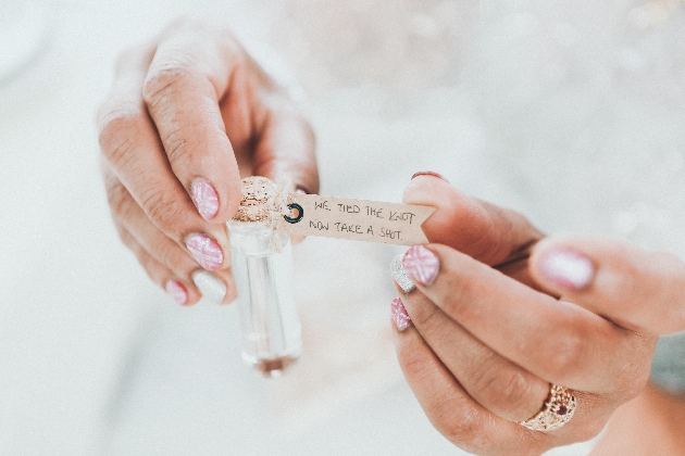 two hands holding a wedding favour shot