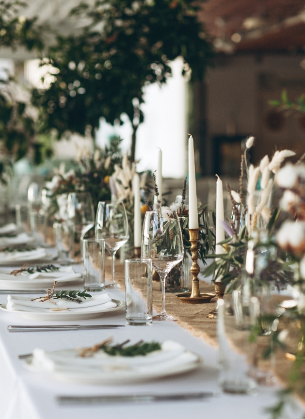 wedding table set up with wine glasses on