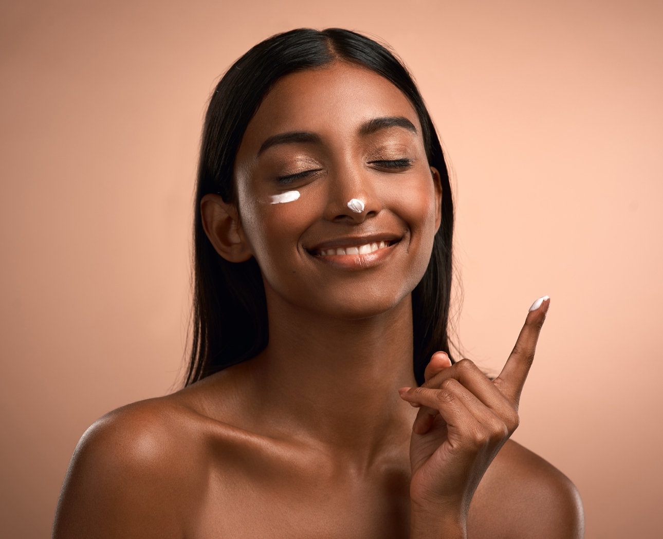 woman with moisturiser on her face 