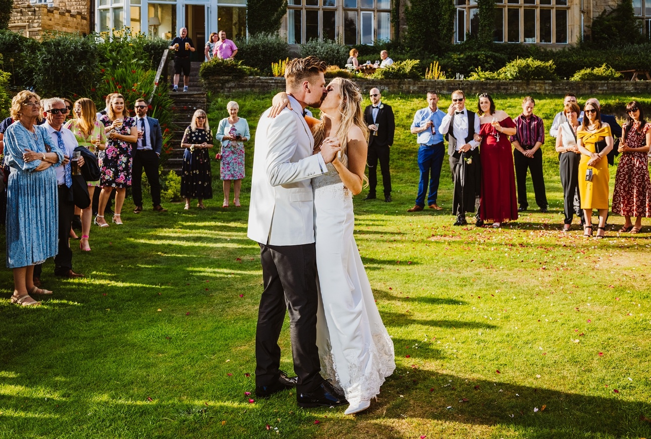 Couple dance on lawn