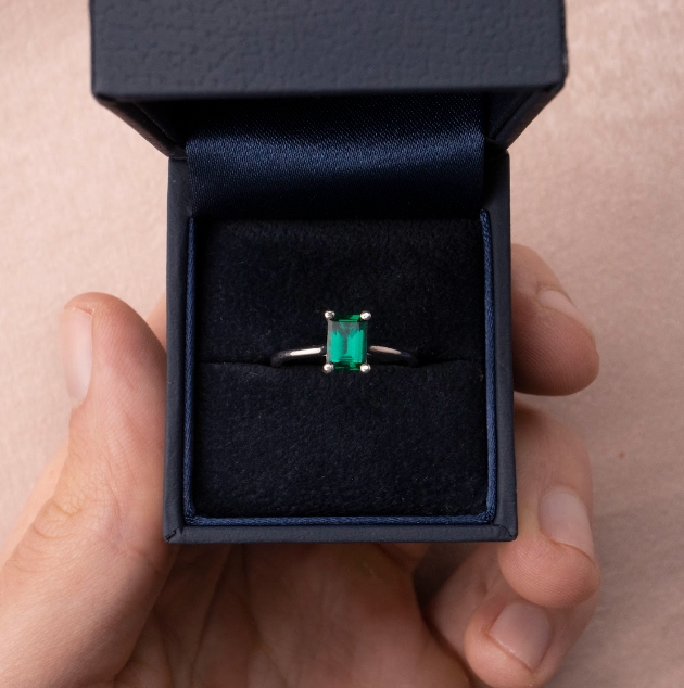 Emerald engagement ring in box