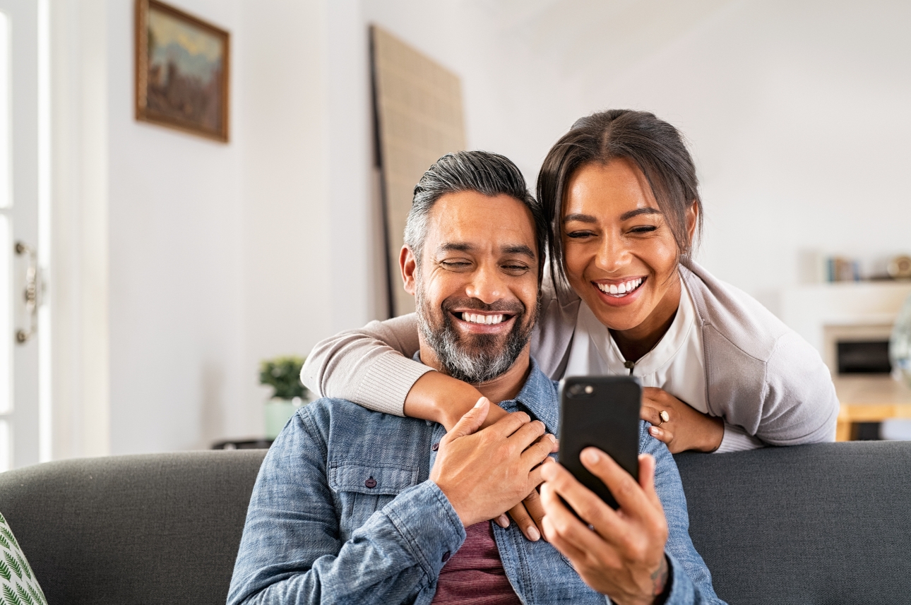 two people looking at a phone together 