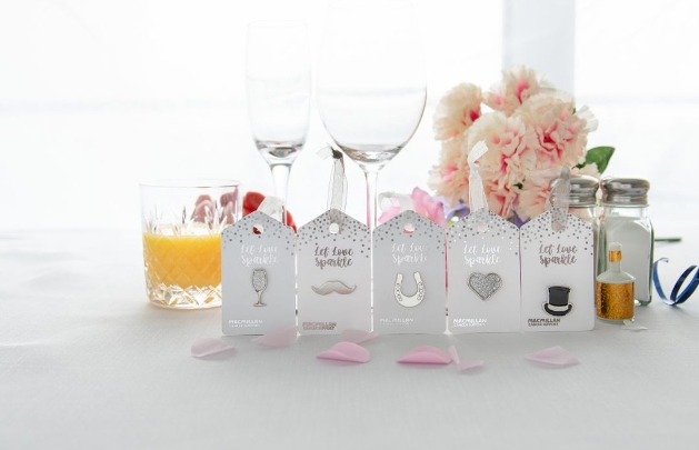 silver pin badge favours in wedding symbols top hat etc