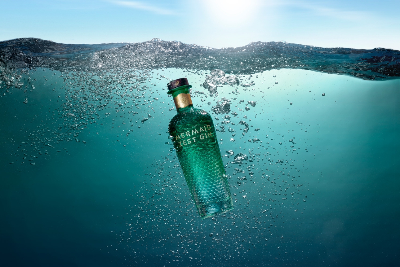 Mermaid Gin bottle floating in the water