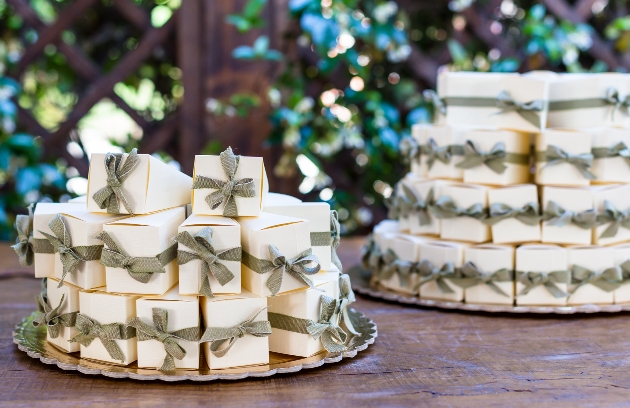 white chocolate boxes with green ribbon