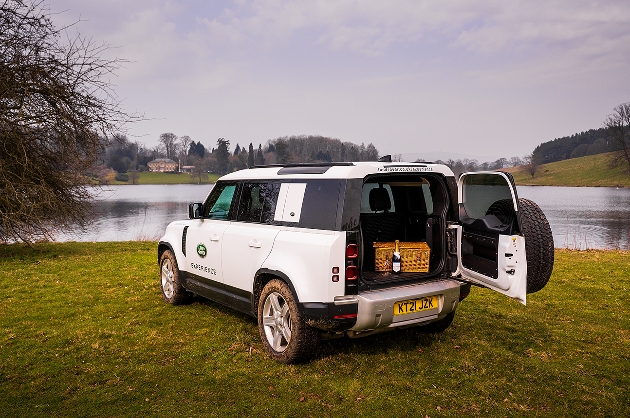 landrover parked with picnic in the back