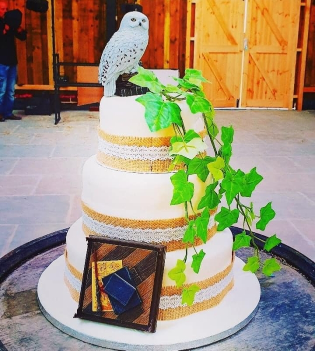 white tiered wedding cake with barn owl figurine