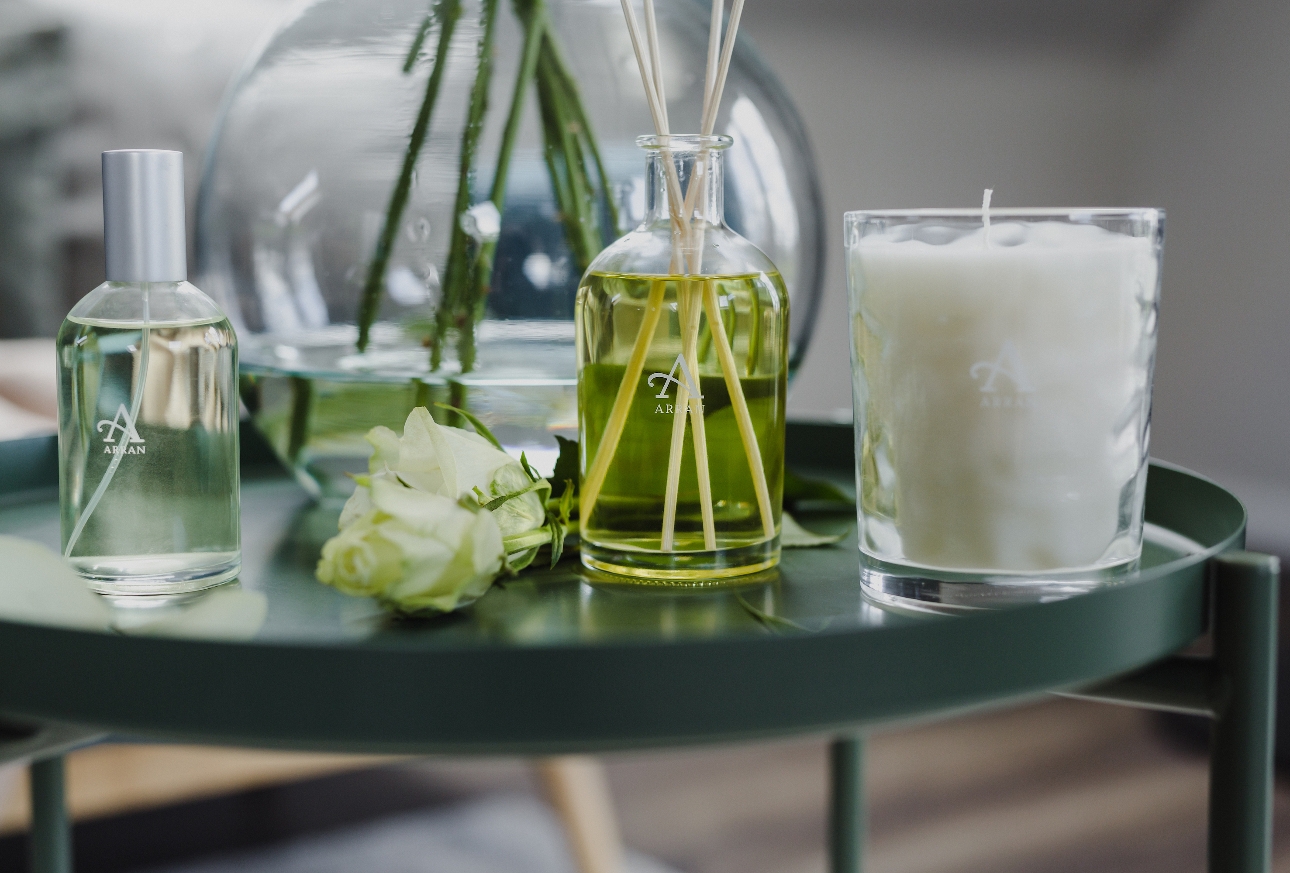 diffuser and candle on a table