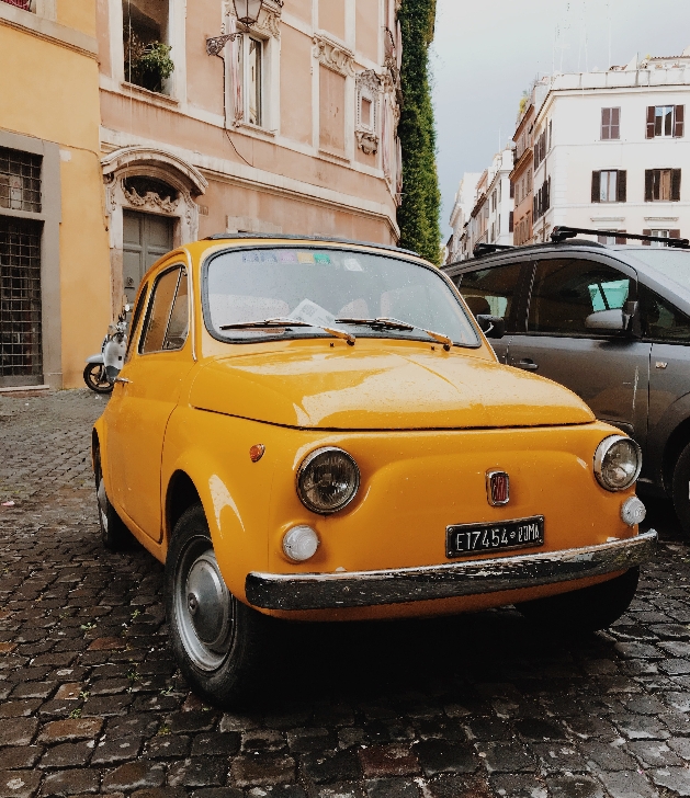 Classic Fiat 500 in mustard yellow