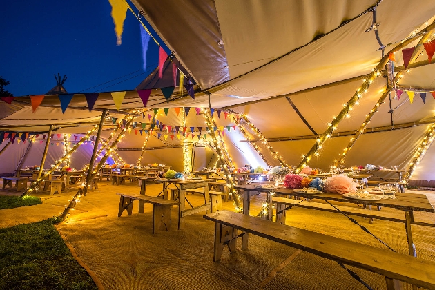evening shot of outside tipi seating area 