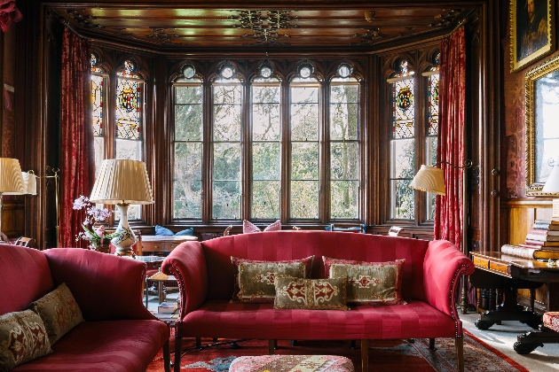 luxury lounge in castle with red velvet cushions