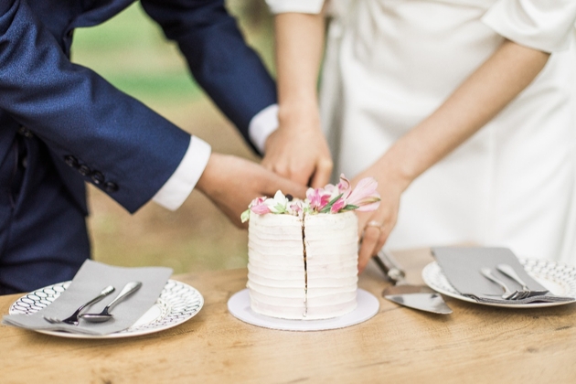 bride and groom cutting cake