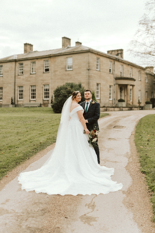 wedding couple outside stately venue