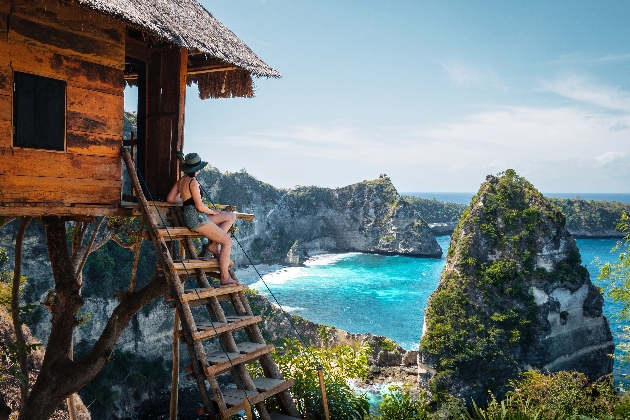 Bali, Indonesia, Traveler on Tree House at Diamond Beach in Nusa Penida Island