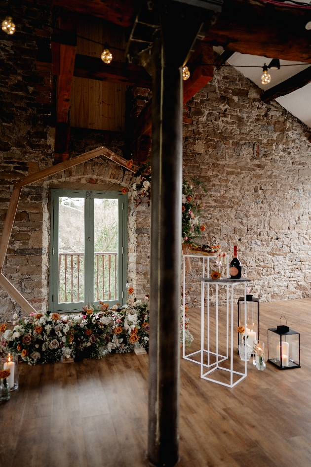 ceremony moongate with brick walls and wooden floors