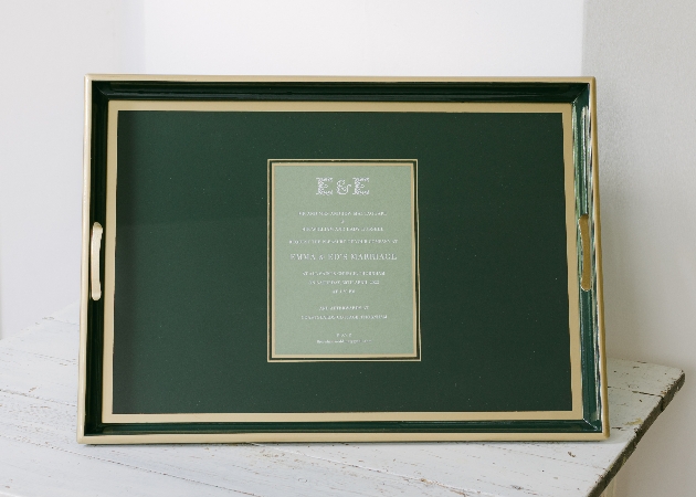 green dinner tray with an invite in the middle
