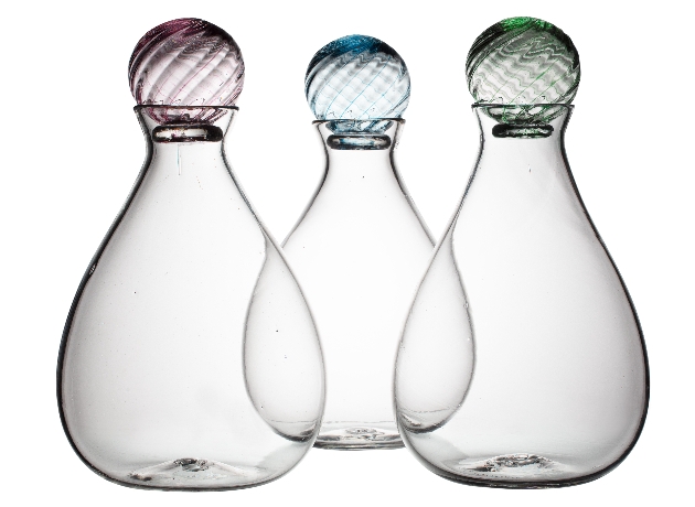thee clear glass decanter with coloured stopper