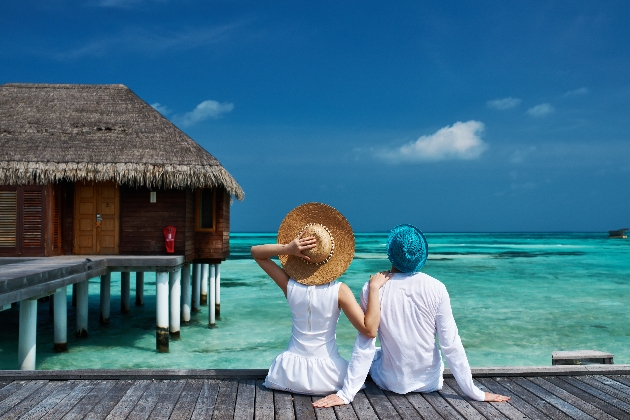 Man and woman looking out at the ocean