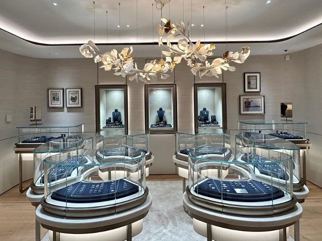 Mappin & Webb's jewellery area floral hanging light, clear glass cabinets blue accents