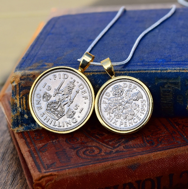 two coins in a necklace linked together