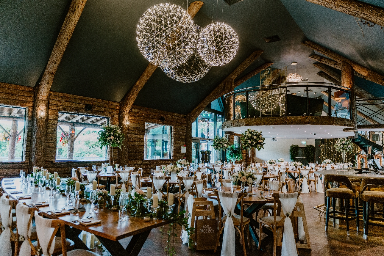 rustic reception room lots of wood ball chandeliers