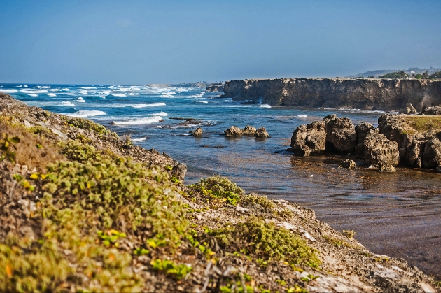 The waves crashing against the shore in Barbados