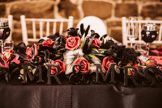 Black and red top table floral centrepiece