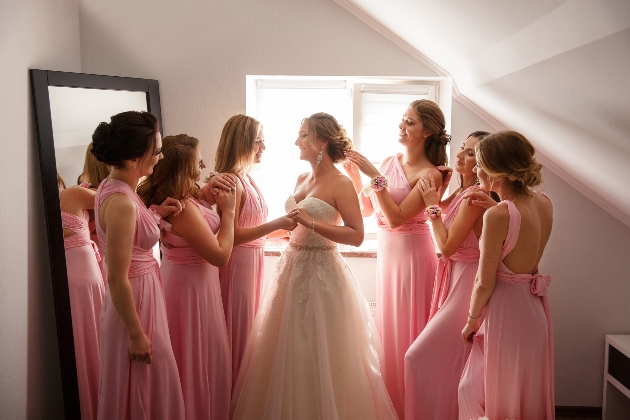 Bride and bridesmaids preparing for the day on wedding morn