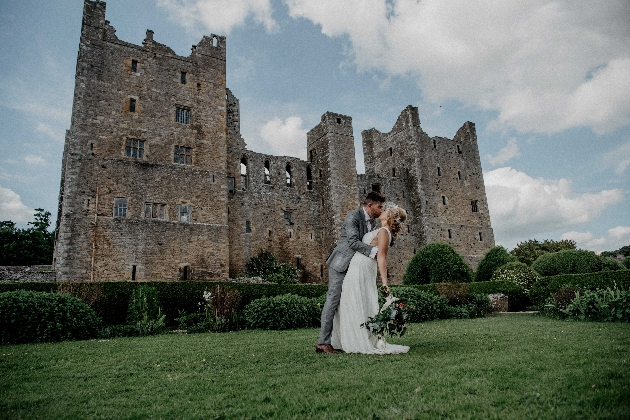 Bolton Castle with bride at groom in the foreground