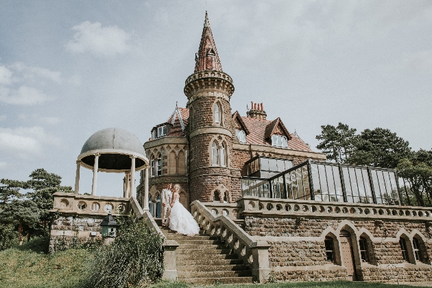 Rushpool hall with bride and groom on steps in front